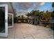 Expansive patio area perfect for entertaining, featuring comfortable seating and views of the surrounding landscape at 1648 Shelburne Ln, Sarasota, FL 34231