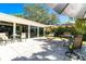 Charming patio featuring swing chairs and outdoor seating, perfect for relaxing and entertaining at 1648 Shelburne Ln, Sarasota, FL 34231
