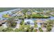 Scenic aerial view of a waterfront property, showcasing the home's location on the canal at 18610 Ayrshire, Port Charlotte, FL 33981