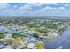 Aerial view of a waterfront community with houses and water access at 18610 Ayrshire, Port Charlotte, FL 33981