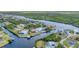Aerial view of waterfront homes with private docks, surrounded by lush greenery at 18610 Ayrshire, Port Charlotte, FL 33981