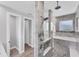Modern bathroom featuring dual shower heads, tiled walls, and glass partition, offering luxury and style at 18610 Ayrshire, Port Charlotte, FL 33981