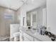 Well-lit bathroom with a walk-in shower, modern fixtures, and a clean, minimalist design for relaxation at 18610 Ayrshire, Port Charlotte, FL 33981