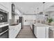 Spacious kitchen with long island, stainless appliances, and white cabinetry with stylish backsplash at 18610 Ayrshire, Port Charlotte, FL 33981