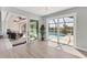 Bright sunroom with multiple sliding glass doors with access to the pool and scenic waterfront views at 18610 Ayrshire, Port Charlotte, FL 33981