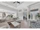 Bright and airy living room with high ceilings, open concept design, and seamless connection to kitchen and lanai at 18610 Ayrshire, Port Charlotte, FL 33981