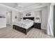 Main bedroom showcases tray ceilings, neutral tones, and ensuite bathroom for serene relaxation at 18610 Ayrshire, Port Charlotte, FL 33981