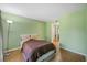 Bedroom featuring hardwood floors and a spacious closet at 19505 Quesada Ave # B202, Port Charlotte, FL 33948