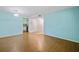 Bright living room with wood floors and fresh, neutral paint at 19505 Quesada Ave # B202, Port Charlotte, FL 33948