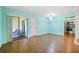 Open-concept living room, with a view of the screened in porch at 19505 Quesada Ave # B202, Port Charlotte, FL 33948