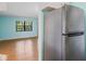 View from the kitchen into the naturally-lit living room at 19505 Quesada Ave # B202, Port Charlotte, FL 33948
