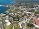 Aerial view showcases the community's waterfront homes, lush landscaping, and the extensive canal system at 202 South Dr, Englewood, FL 34223