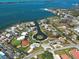 Stunning aerial view of waterfront homes with canal access to the open bay and beautiful landscaping at 202 South Dr, Englewood, FL 34223