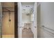Bathroom featuring shower stall and separate toilet area with modern fixtures and wood-look flooring at 202 South Dr, Englewood, FL 34223