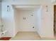 Large laundry room area with washer and dryer hookups and storage at 202 South Dr, Englewood, FL 34223