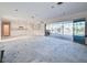 Expansive living area featuring a walkout to a screened pool and waterfront view at 202 South Dr, Englewood, FL 34223