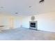 A bright, open living area with a fireplace, recessed lighting, and a neutral color palette for personalization at 202 South Dr, Englewood, FL 34223