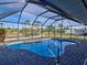 Inviting screened-in pool area with a view of the waterfront, offering a private and serene outdoor oasis at 202 South Dr, Englewood, FL 34223