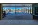 Screened lanai showcasing a waterfront view, pool, and spacious outdoor seating area for relaxation and entertainment at 202 South Dr, Englewood, FL 34223