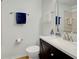 Bathroom with dark vanity, white countertop, and mirrored shower at 220 Southampton Drive # 325, Venice, FL 34293