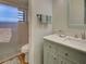 Bathroom featuring a shower with glass doors and a bright vanity area at 220 Southampton Drive # 325, Venice, FL 34293