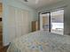 Bedroom with patio access and large closet at 220 Southampton Drive # 325, Venice, FL 34293
