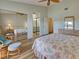 Open bedroom featuring a large closet, bathroom, and lake views at 220 Southampton Drive # 325, Venice, FL 34293