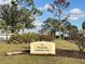 Community park sign surrounded by well-maintained landscaping and mature trees at 220 Southampton Drive # 325, Venice, FL 34293