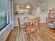 View of dining area with round table and a glimpse of the kitchen at 220 Southampton Drive # 325, Venice, FL 34293