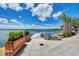 View of community lake with dock, kayak and landscaping. A great place to spend the day! at 220 Southampton Drive # 325, Venice, FL 34293