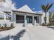 Stunning exterior with sleek steps and a large concrete driveway, ideal for stylish living and curb appeal at 220 Southampton Drive # 325, Venice, FL 34293