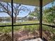 Screened patio with a lake view, perfect for enjoying the outdoors at 220 Southampton Drive # 325, Venice, FL 34293