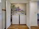 Laundry closet featuring a stacked washer and dryer at 220 Southampton Drive # 325, Venice, FL 34293