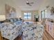 Comfortable living room with plush seating, decorative art, and natural light at 220 Southampton Drive # 325, Venice, FL 34293
