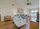 Bright living room with a high vaulted ceiling and modern furniture at 220 Southampton Drive # 325, Venice, FL 34293