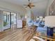 Expansive living area connects the dining area and the sliding glass door to the lanai at 220 Southampton Drive # 325, Venice, FL 34293