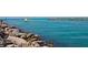 Picturesque ocean view with rocky shorelines and turquoise waters, ideal for fishing and scenic walks at 220 Southampton Drive # 325, Venice, FL 34293
