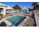 Inviting community pool and hot tub with ample seating and pristine landscaping for relaxation and enjoyment at 220 Southampton Drive # 325, Venice, FL 34293