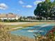 Community shuffleboard court and basketball court in a well-maintained residential area with mature landscaping at 220 Southampton Drive # 325, Venice, FL 34293