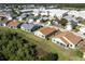 Aerial view of homes with well-kept lawns, and natural surroundings at 24135 Buckingham Way, Punta Gorda, FL 33980