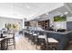 Stylish bar area with ample seating and well-stocked shelves, ideal for social gatherings at 24135 Buckingham Way, Punta Gorda, FL 33980