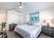 Bright bedroom features a ceiling fan, closet, and coastal-themed decor at 24135 Buckingham Way, Punta Gorda, FL 33980