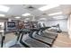 Community gym featuring modern treadmills and exercise equipment with a wall of books adding character at 24135 Buckingham Way, Punta Gorda, FL 33980