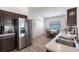 Well-lit kitchen with stainless steel appliances and breakfast nook at 24135 Buckingham Way, Punta Gorda, FL 33980