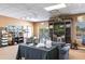 Relaxing lounge area with comfortable seating and a television tuned to a golf event at 24135 Buckingham Way, Punta Gorda, FL 33980