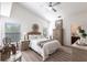 Cozy main bedroom features a neutral color palette and en suite bathroom at 24135 Buckingham Way, Punta Gorda, FL 33980