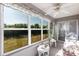 Light-filled sunroom with large windows showcasing the outdoor view at 24135 Buckingham Way, Punta Gorda, FL 33980