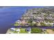 Stunning aerial view of waterfront homes showcasing beautiful canals, lush landscaping, and luxurious living at 2418 Herron Ter, Port Charlotte, FL 33981