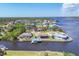 Expansive aerial view of waterfront community boasting serene waterways and beautiful residential properties at 2418 Herron Ter, Port Charlotte, FL 33981