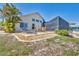 Spacious backyard featuring a patio seating area, lush landscaping, and direct access to the water at 2418 Herron Ter, Port Charlotte, FL 33981